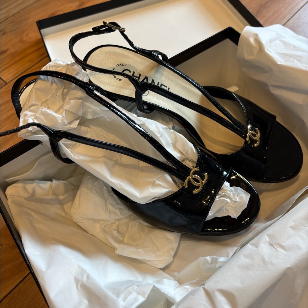 CHANEL Glossy Black Sandals with Gold Accents